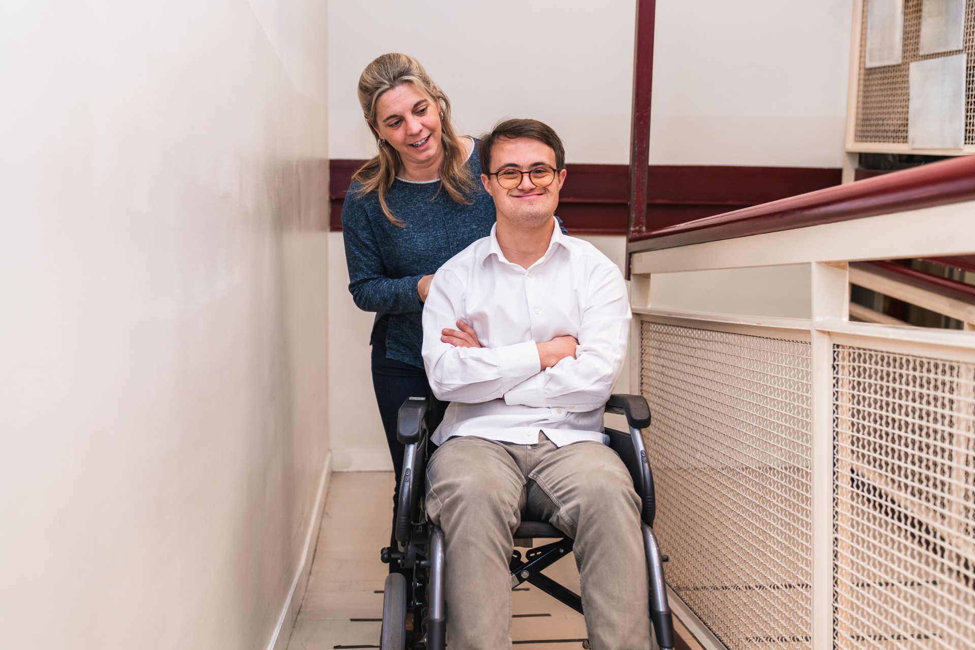 Warm Companionship: Supportive Woman Pushing Man's Wheelchair